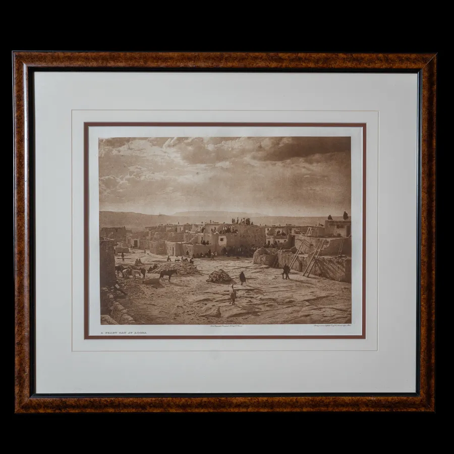 A Feast Day at Acoma photogravure by Edward S. Curtis, 1904 - multi-tiered dwellings atop Sky City in western New Mexico with figures gathered in the central plaza