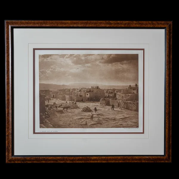 A Feast Day at Acoma photogravure by Edward S. Curtis, 1904 - multi-tiered dwellings atop Sky City in western New Mexico with figures gathered in the central plaza