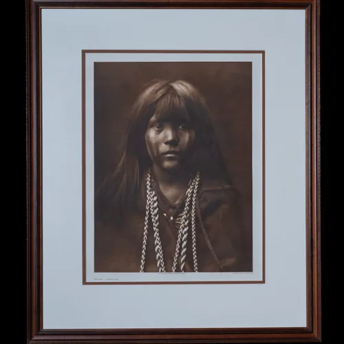 Mosa-Mohave photogravure by Edward S. Curtis, 1903 - portrait of a young Mohave woman with long hair and braided necklaces