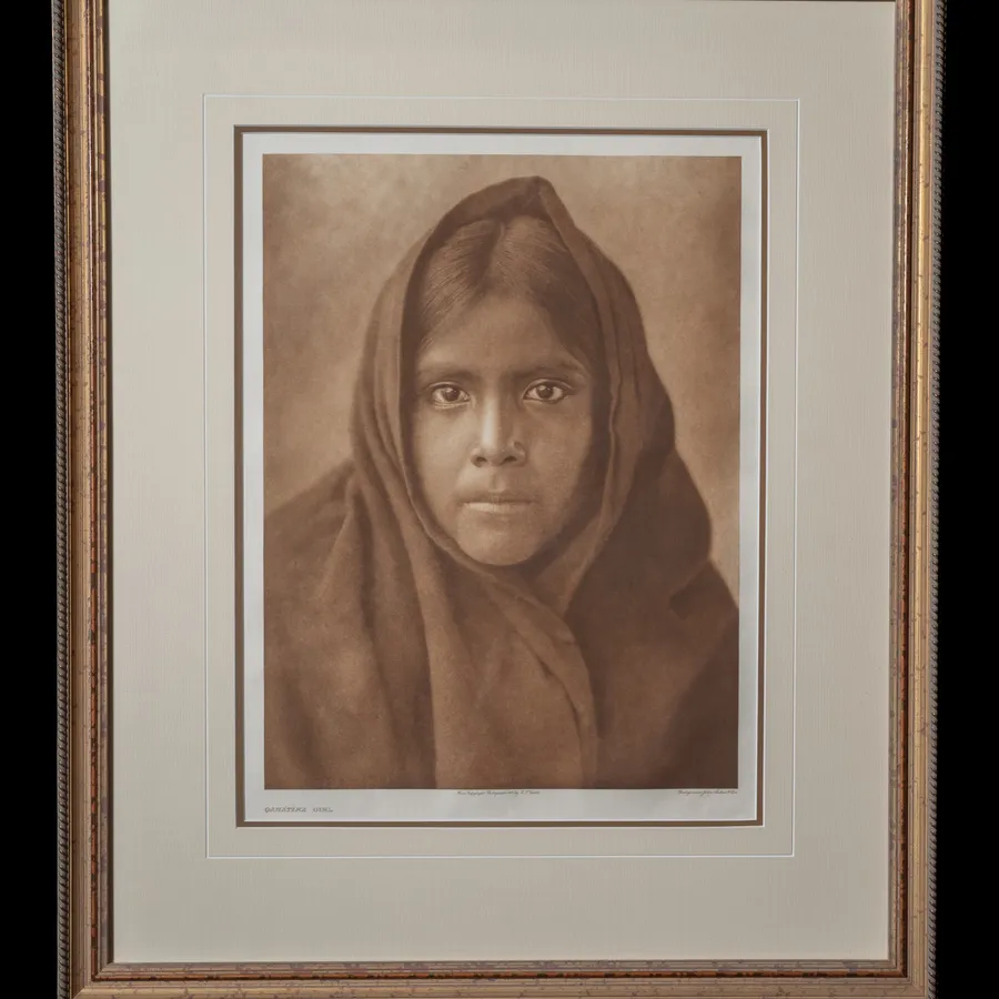 Qahatyka Girl photogravure by Edward S. Curtis, 1907 - young girl wrapped in a brown-tinted robe against a misty background