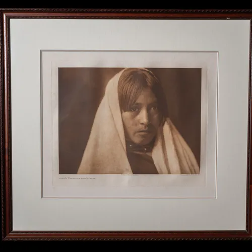 Walvia Medicine Root photogravure by Edward S. Curtis, 1905 - three-quarter portrait of a Taos woman with dark hair parted at top and a white shawl over her head