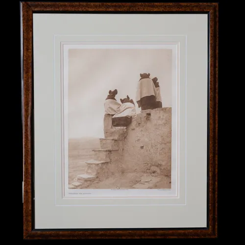 Watching the Dancers photogravure by Edward S. Curtis, 1906 - Pueblo women in ceremonial garb ascending stone steps of an adobe structure