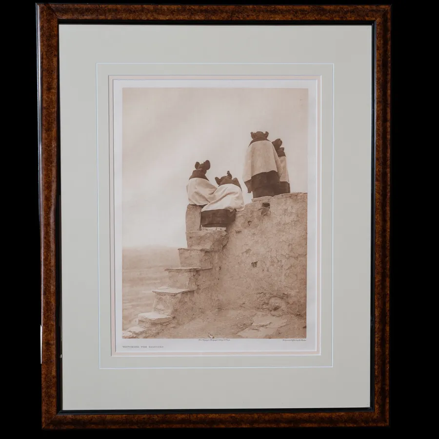 Watching the Dancers photogravure by Edward S. Curtis, 1906 - Pueblo women in ceremonial garb ascending stone steps of an adobe structure